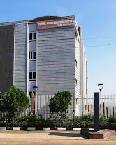 The tall stone-clad tower of Royal Continental Hotels and Apartments, Abuja