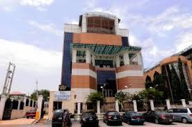The blue-and-brick exterior and driveway of Statement Hotel, Abuja