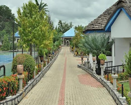 The landscaped garden walkway leading to the chalets at Royal Choice Inn, Abuja