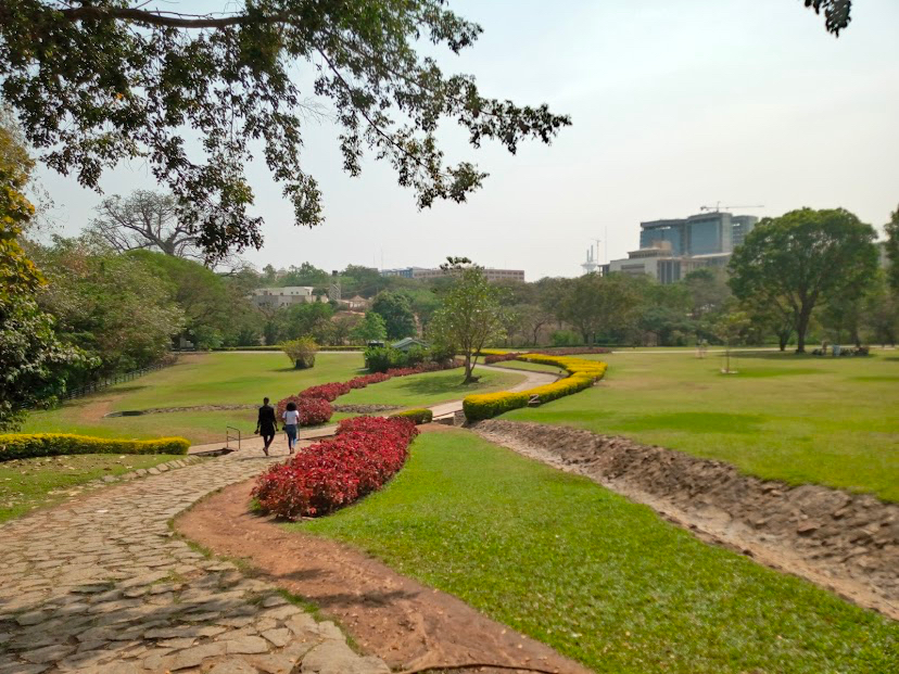 Manicured lawns and flower-lined walkways at Millennium Park, Abuja